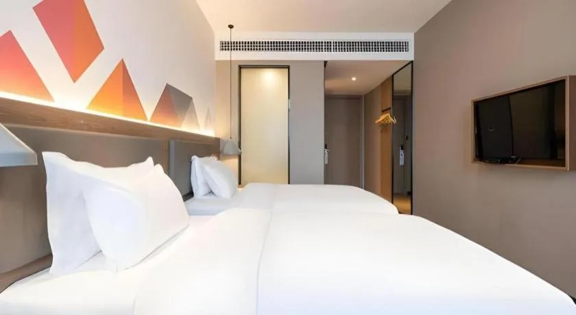 Bed in Borrman Hotel Zhonghsan Guzheng Huayi Plaza Light Rail Station