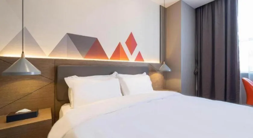 Bed in Borrman Hotel Zhonghsan Guzheng Huayi Plaza Light Rail Station
