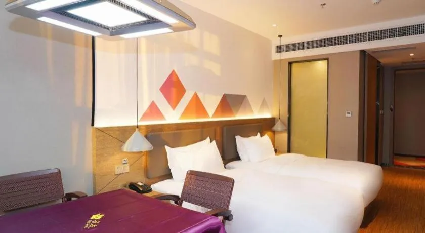 Bed in Borrman Hotel Zhonghsan Guzheng Huayi Plaza Light Rail Station