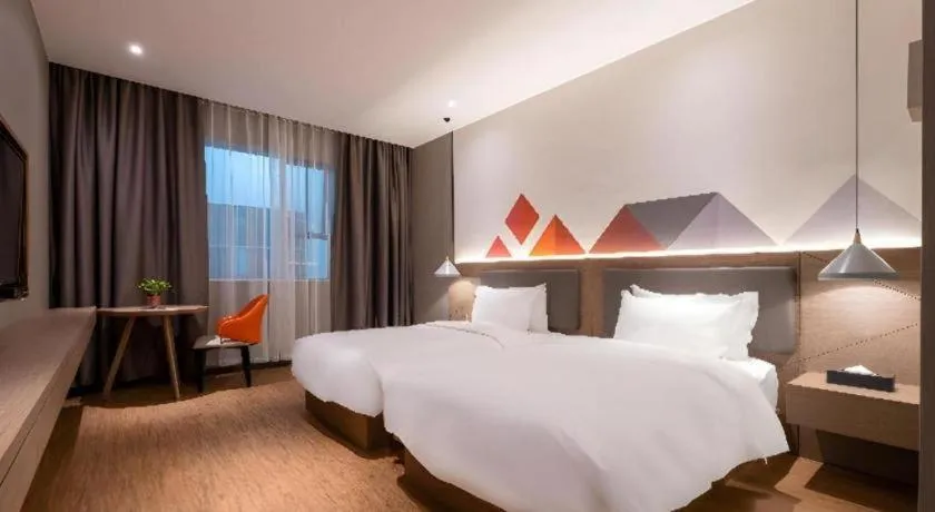 Bed in Borrman Hotel Zhonghsan Guzheng Huayi Plaza Light Rail Station