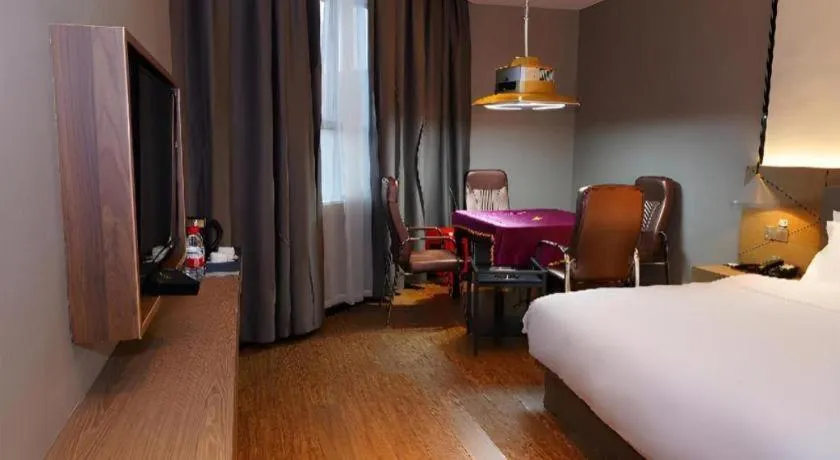 Bed in Borrman Hotel Zhonghsan Guzheng Huayi Plaza Light Rail Station