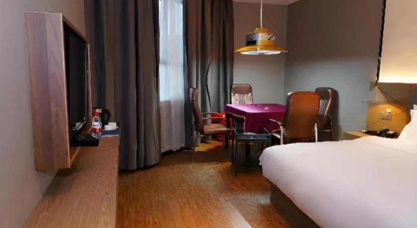 Bed in Borrman Hotel Zhonghsan Guzheng Huayi Plaza Light Rail Station