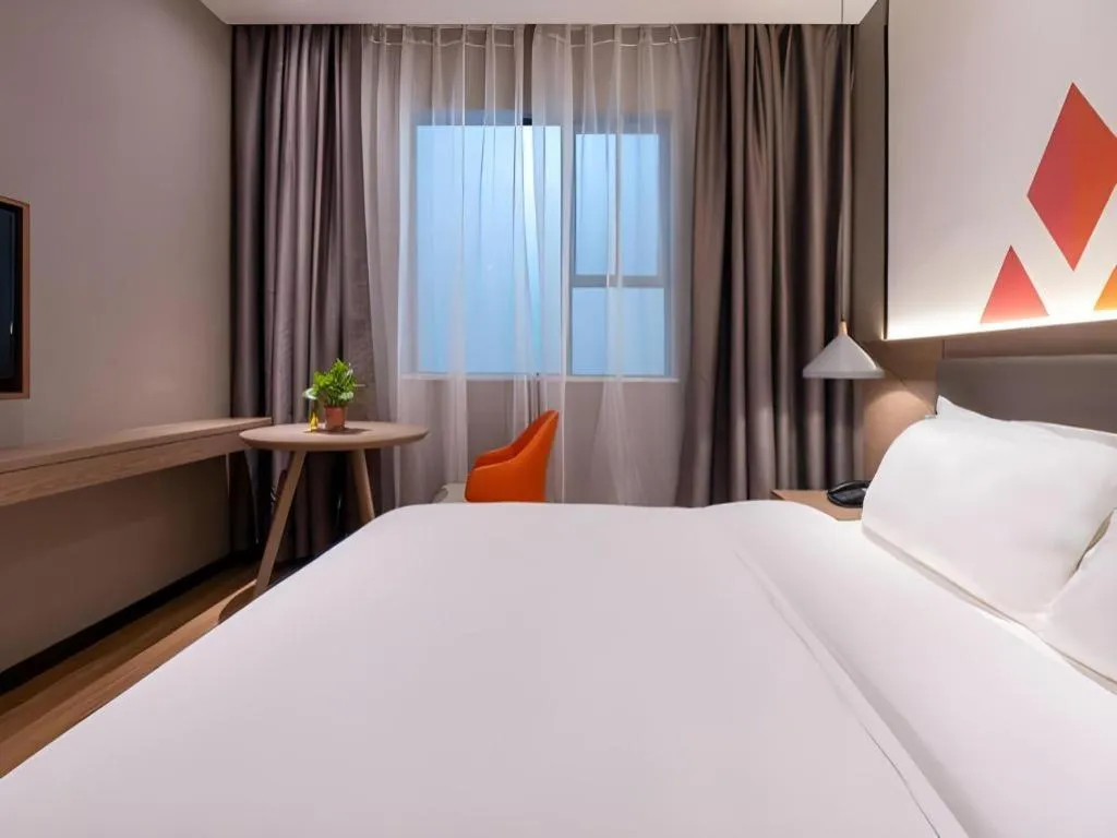 Bed in Borrman Hotel Zhonghsan Guzheng Huayi Plaza Light Rail Station