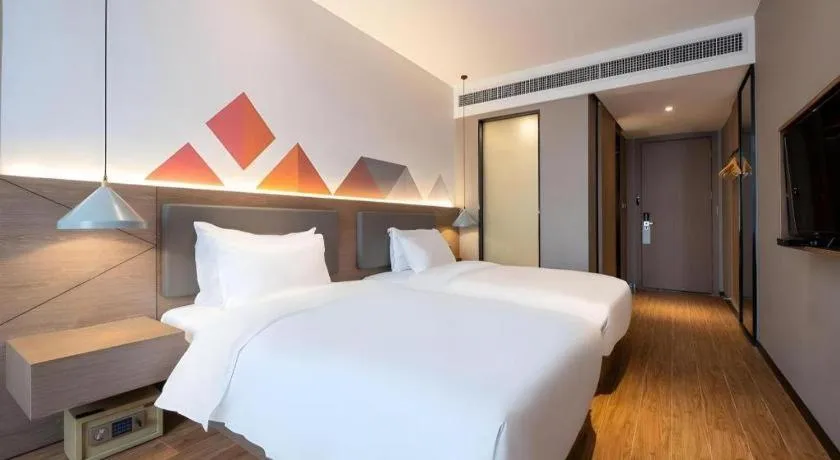 Bed in Borrman Hotel Zhonghsan Guzheng Huayi Plaza Light Rail Station