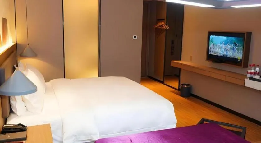 Bed in Borrman Hotel Zhonghsan Guzheng Huayi Plaza Light Rail Station