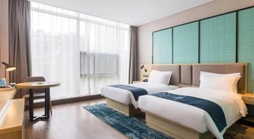 Bed in Echarm Hotel Suzhou Shengze Oriental Extile City