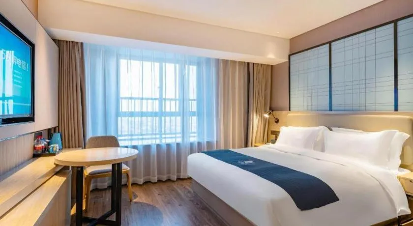 Bed in Echarm Hotel Suzhou Shengze Oriental Extile City