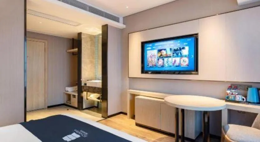 Bed in Echarm Hotel Suzhou Shengze Oriental Extile City