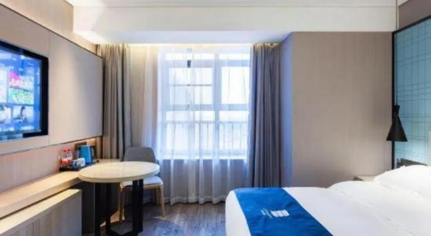 Bed in Echarm Hotel Suzhou Shengze Oriental Extile City