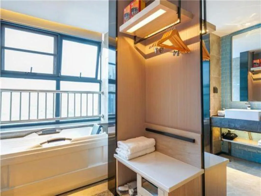 Bed in Echarm Hotel Suzhou Shengze Oriental Extile City