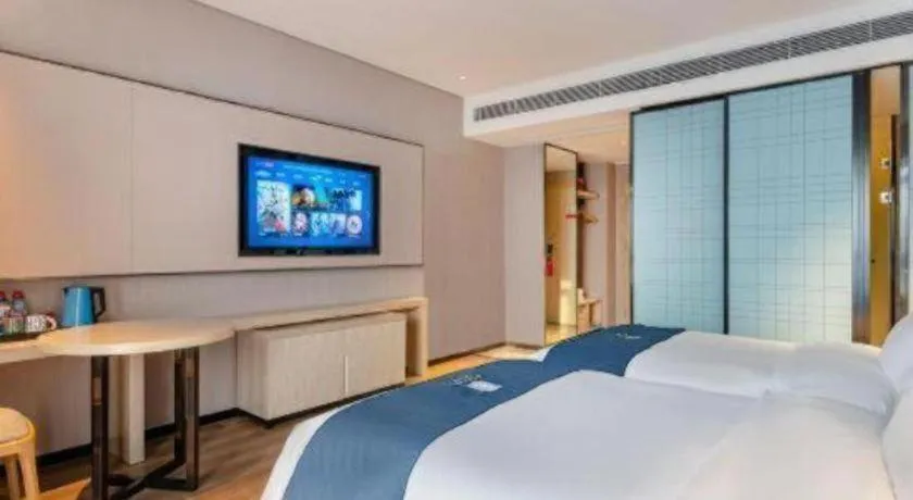 Bed in Echarm Hotel Suzhou Shengze Oriental Extile City
