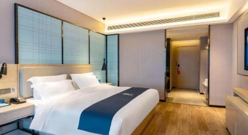 Bed in Echarm Hotel Suzhou Shengze Oriental Extile City