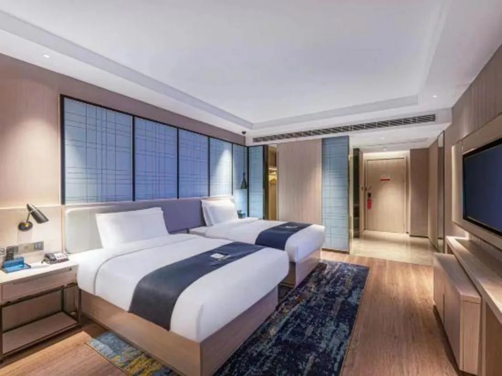 Bed in Echarm Hotel Suzhou Shengze Oriental Extile City