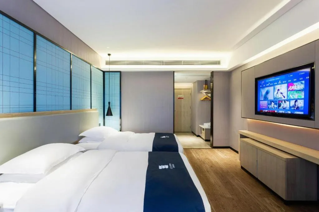 Bed in Echarm Hotel Suzhou Shengze Oriental Extile City