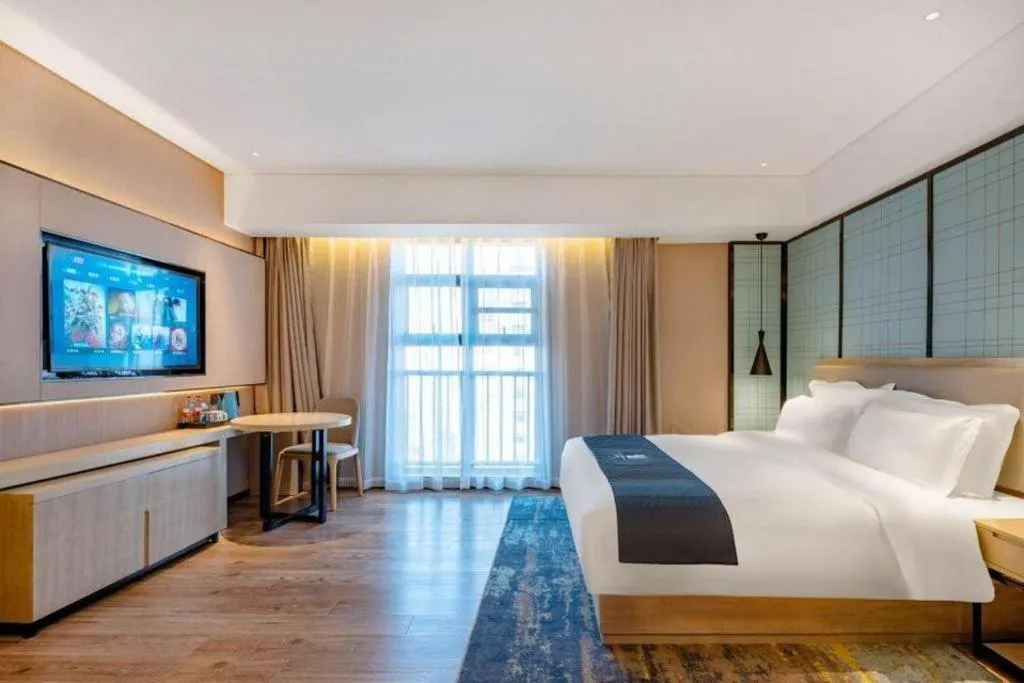 Bed in Echarm Hotel Suzhou Shengze Oriental Extile City