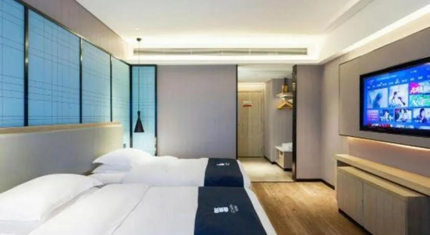 Bed in Echarm Hotel Suzhou Shengze Oriental Extile City