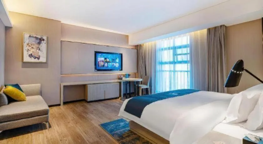 Bed in Echarm Hotel Suzhou Shengze Oriental Extile City