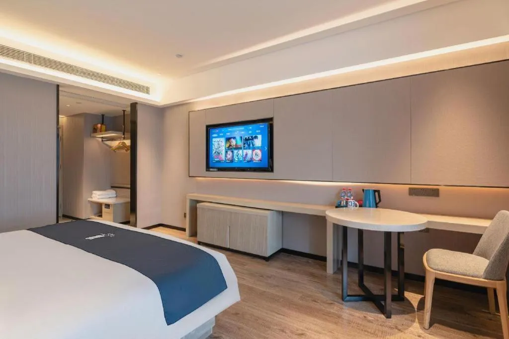 Bed in Echarm Hotel Suzhou Shengze Oriental Extile City