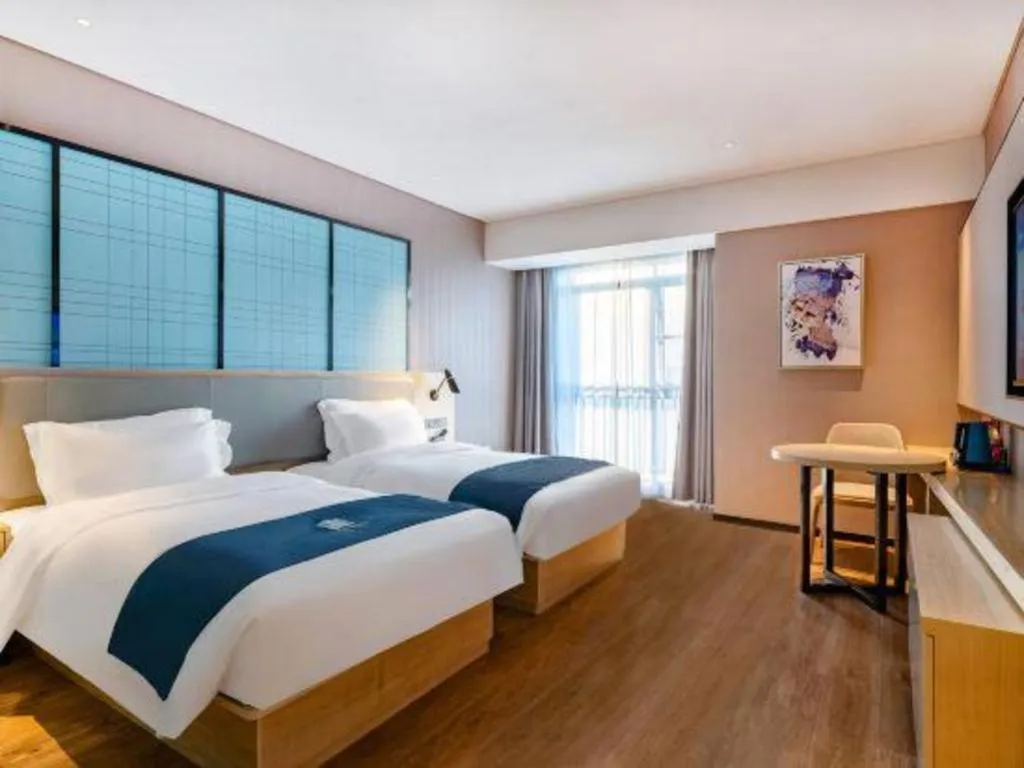 Bed in Echarm Hotel Suzhou Shengze Oriental Extile City