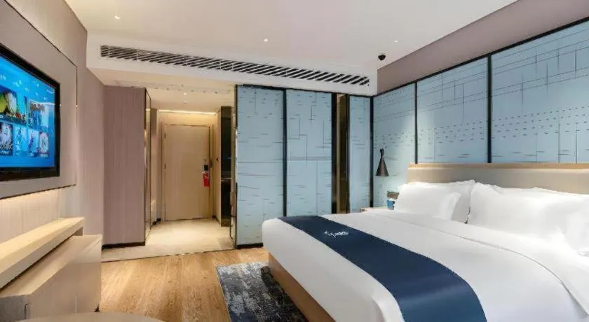 Bed in Echarm Hotel Suzhou Shengze Oriental Extile City