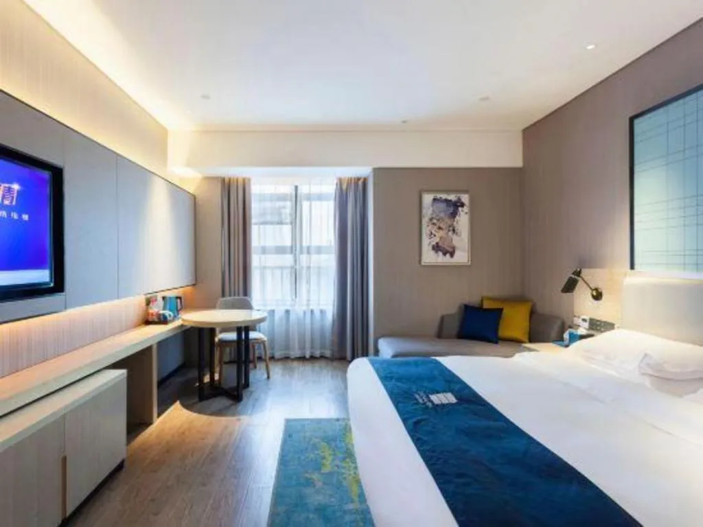 Bed in Echarm Hotel Suzhou Shengze Oriental Extile City