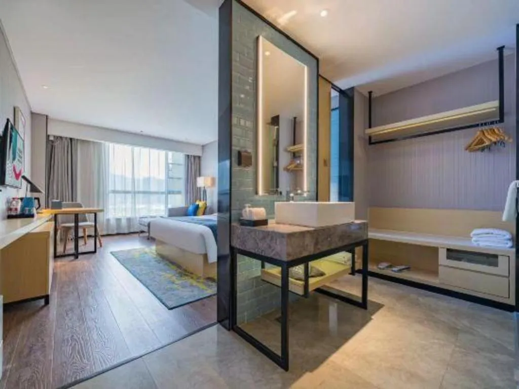 Bed in Echarm Hotel Suzhou Shengze Oriental Extile City