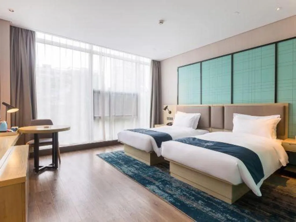 Bed in Echarm Hotel Suzhou Shengze Oriental Extile City