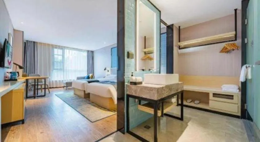 Bed in Echarm Hotel Suzhou Shengze Oriental Extile City