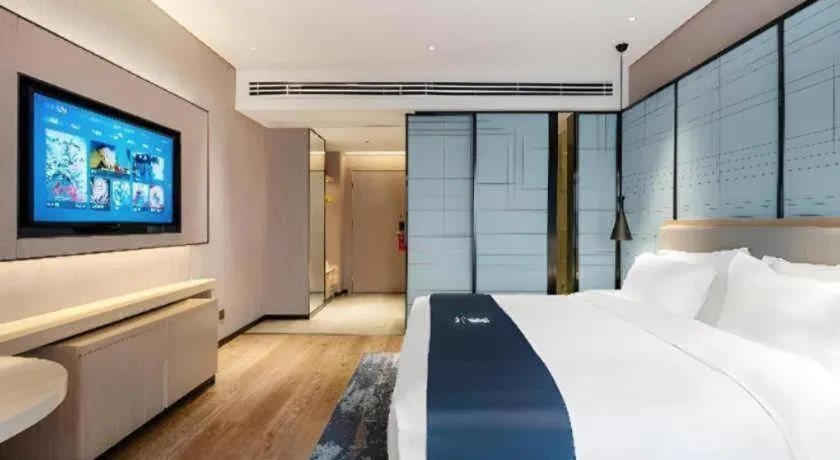 Bed in Echarm Hotel Suzhou Shengze Oriental Extile City