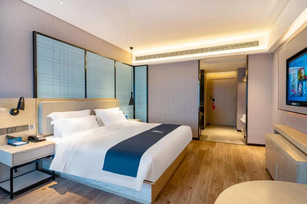 Bed in Echarm Hotel Suzhou Shengze Oriental Extile City