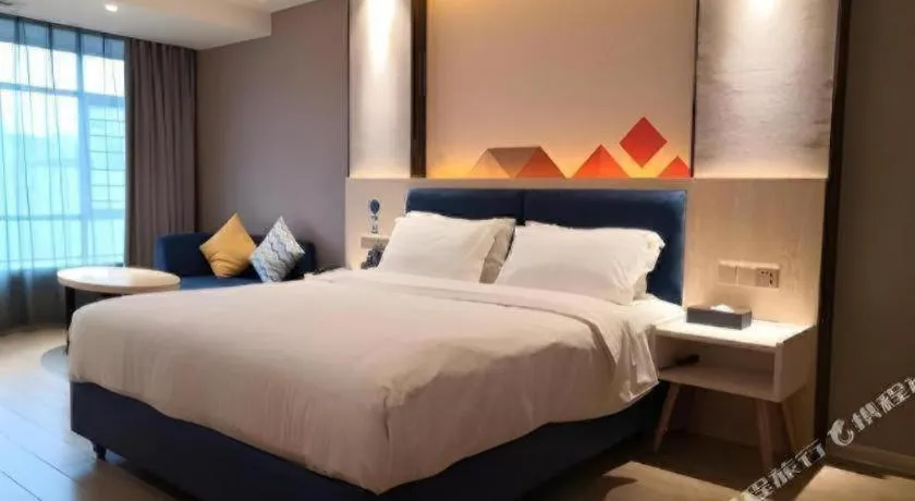 Bed in Borrman Hotel Liuzhou High-Speed Railway Station