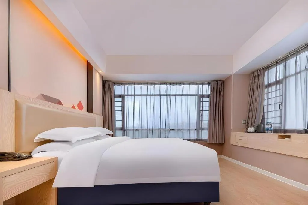 Bed in Borrman Hotel Liuzhou High-Speed Railway Station