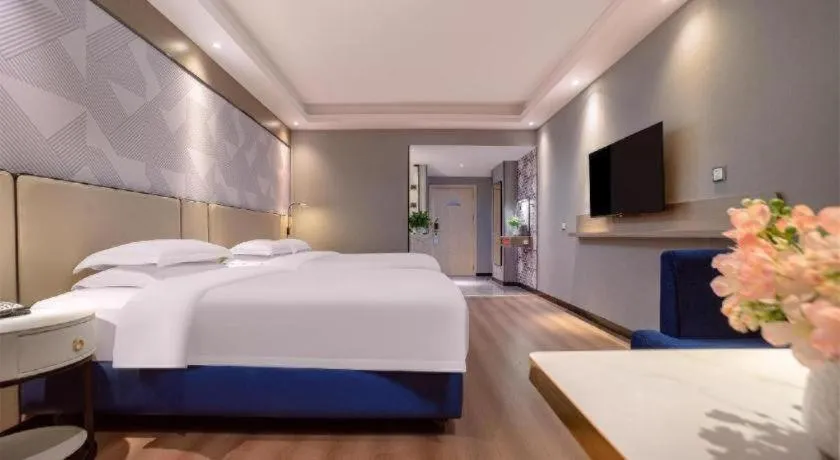 Bed in Borrman Hotel Liuzhou High-Speed Railway Station