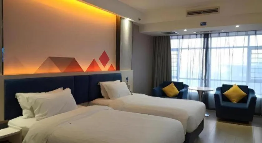 Bed in Borrman Hotel Liuzhou High-Speed Railway Station