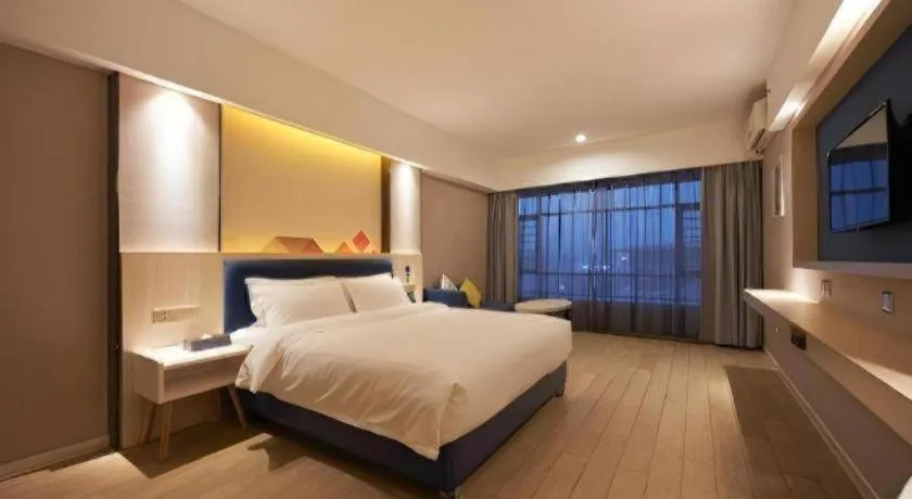 Bed in Borrman Hotel Liuzhou High-Speed Railway Station