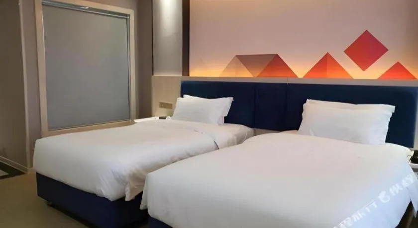 Bed in Borrman Hotel Liuzhou High-Speed Railway Station