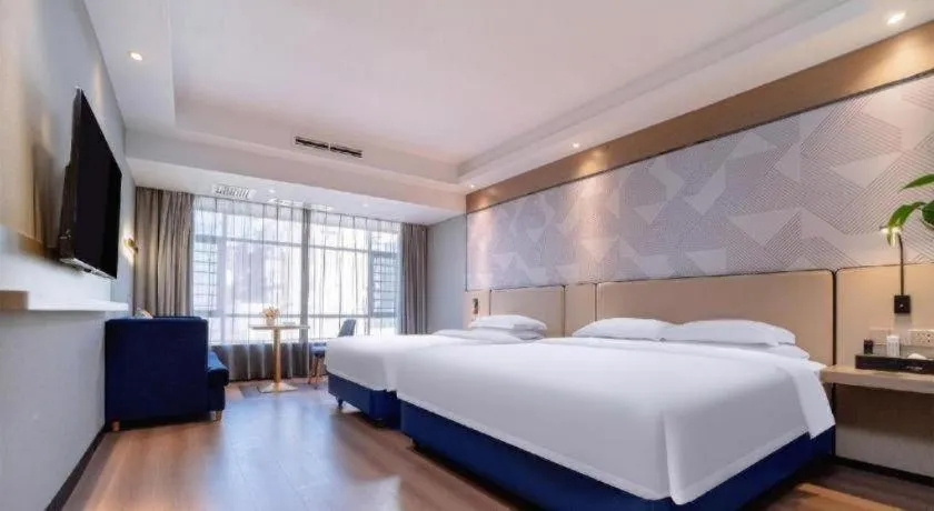 Bed in Borrman Hotel Liuzhou High-Speed Railway Station
