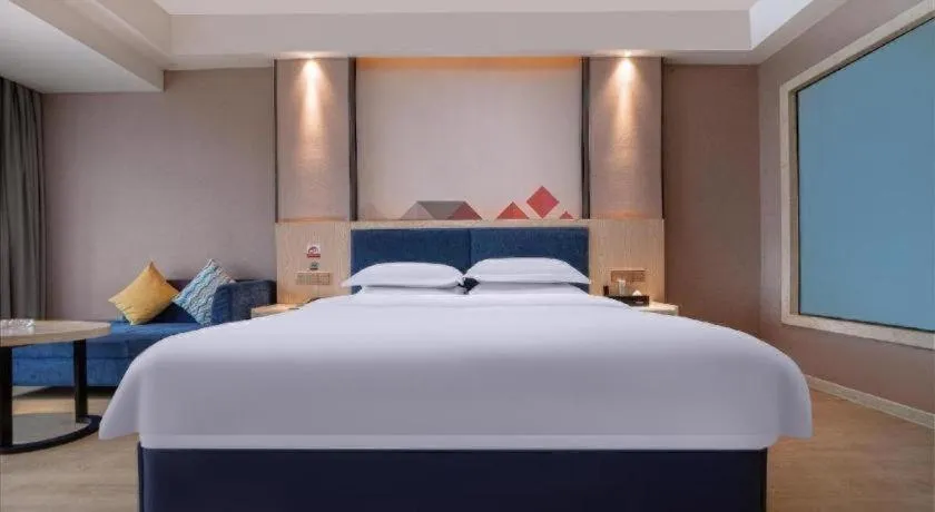 Bed in Borrman Hotel Liuzhou High-Speed Railway Station