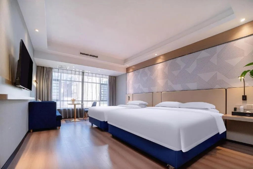Bed in Borrman Hotel Liuzhou High-Speed Railway Station