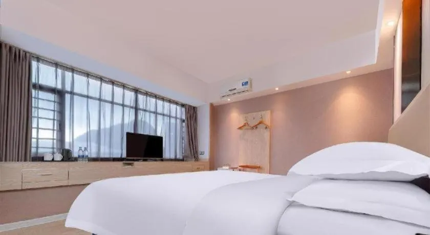 Bed in Borrman Hotel Liuzhou High-Speed Railway Station
