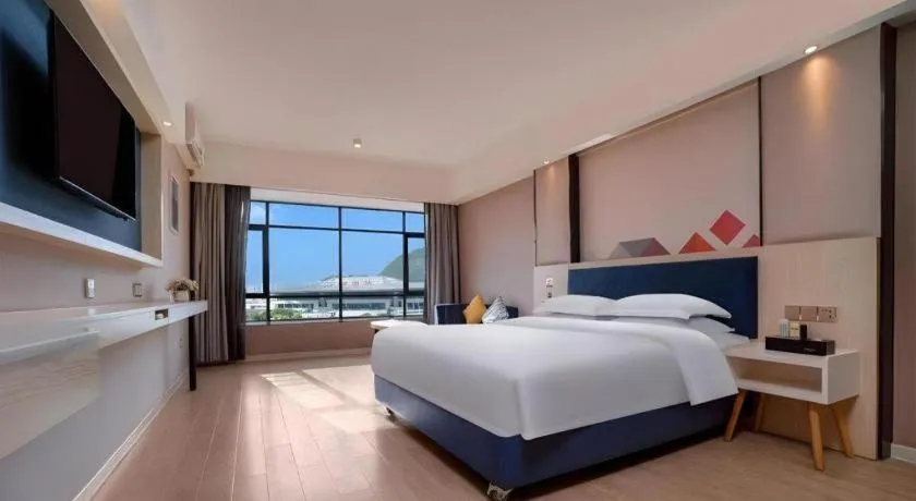 Bed in Borrman Hotel Liuzhou High-Speed Railway Station