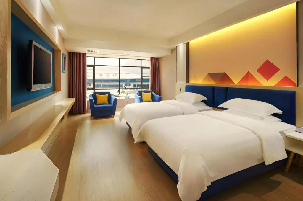 Bed in Borrman Hotel Liuzhou High-Speed Railway Station