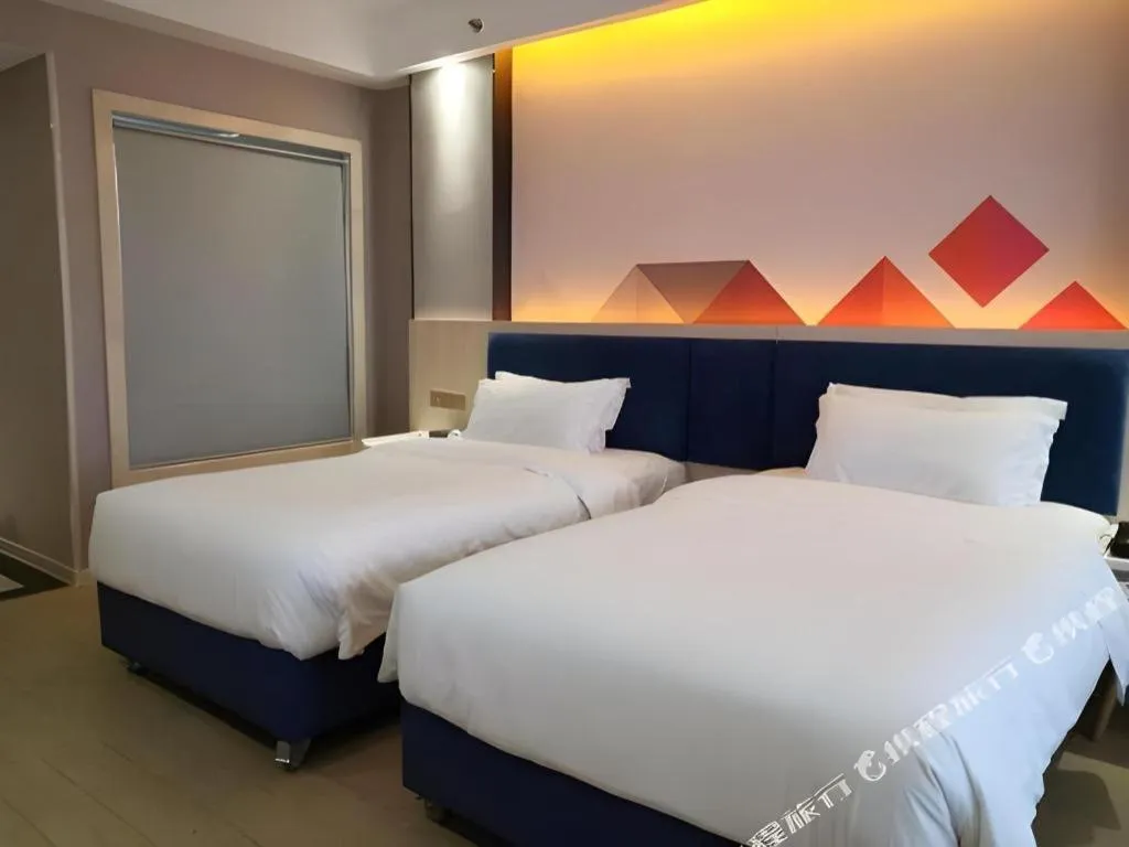 Bed in Borrman Hotel Liuzhou High-Speed Railway Station