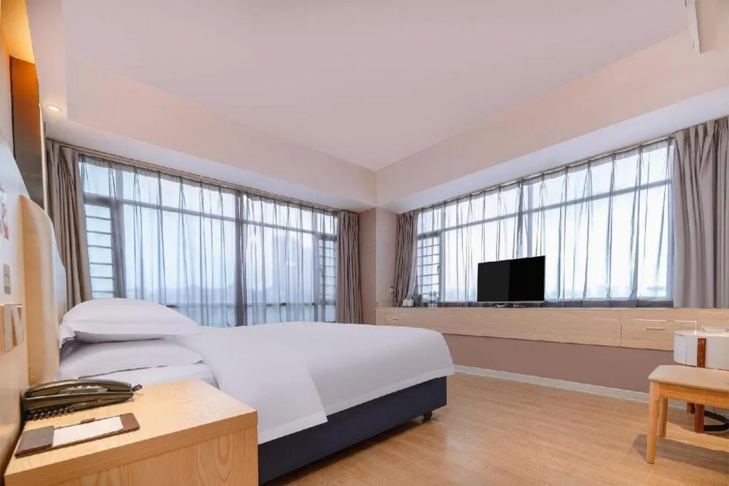 Bed in Borrman Hotel Liuzhou High-Speed Railway Station