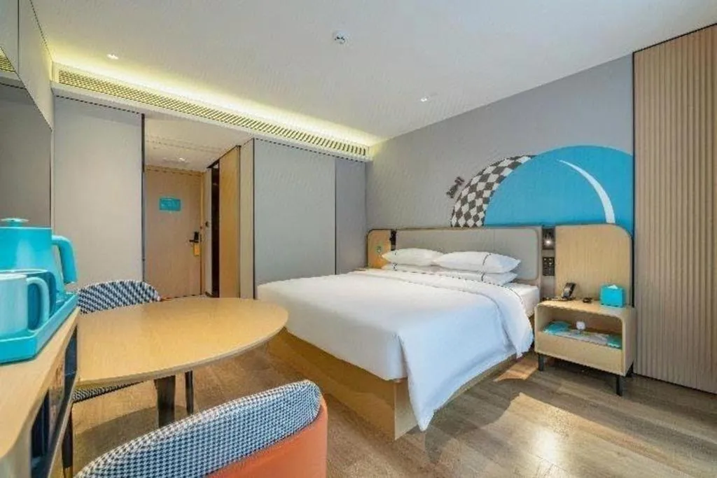 Bed in City Comfort Inn Shaoguan Biguiyuan Phoenix City Gold Village