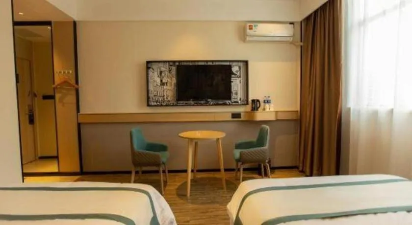 Bed in City Comfort Inn Shaoguan Biguiyuan Phoenix City Gold Village