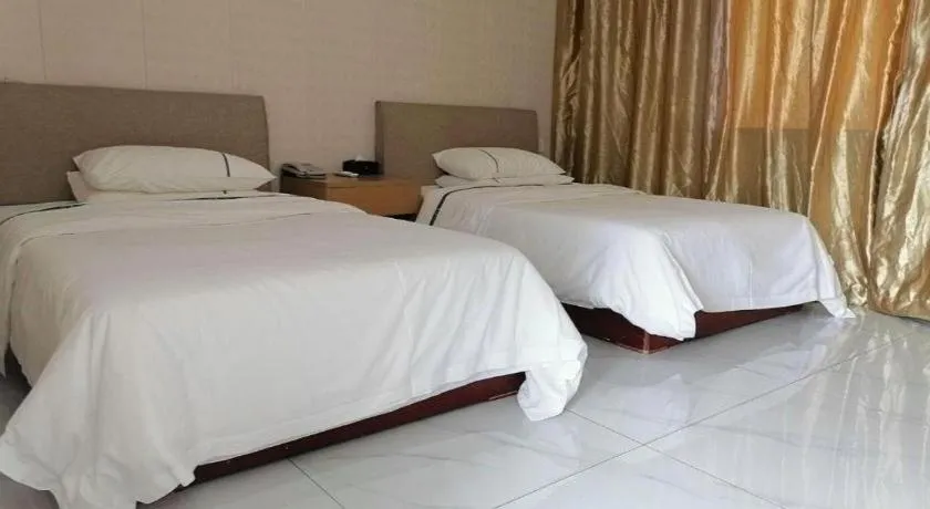 Bed in City Comfort Inn Shaoguan Biguiyuan Phoenix City Gold Village