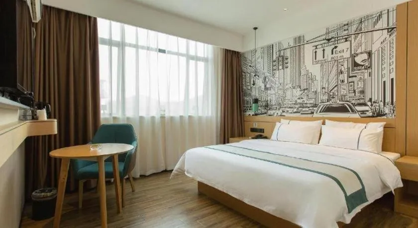 Bed in City Comfort Inn Shaoguan Biguiyuan Phoenix City Gold Village