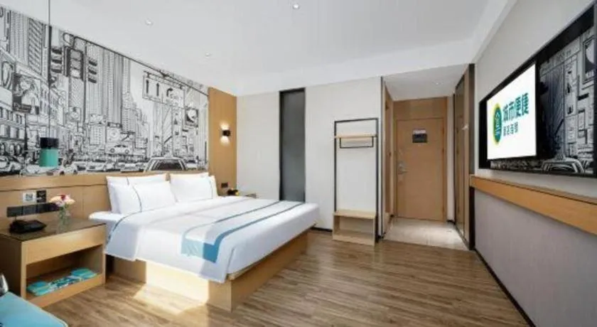 Bed in City Comfort Inn Shaoguan Biguiyuan Phoenix City Gold Village