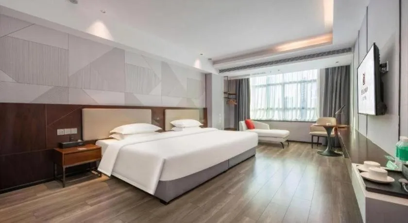 Bed in Borrman Hotel Yunfu Xinxing County Bus Station